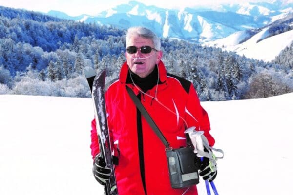 Inogen Rove 6 portable concentrator worn by man skiing